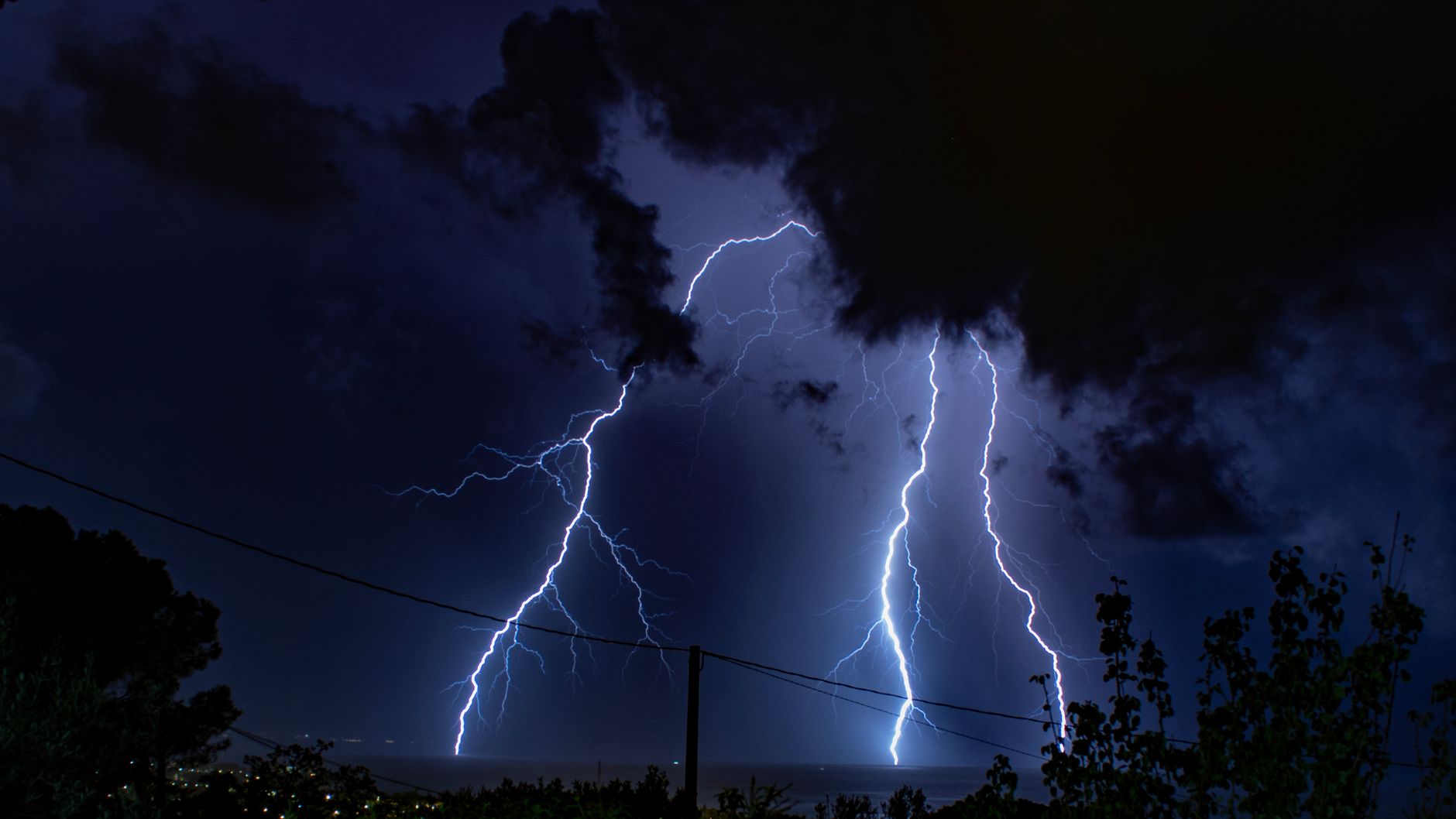 view of a large lightning bolt at night